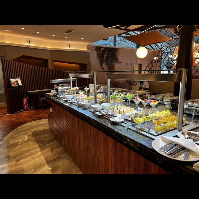 The Primeclass Lounge at Ivato International Airport features a self-serve buffet with a variety of sandwiches, salads, and desserts.