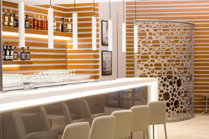 The bar in Ahlein Premium Lounge at Beirut Airport offers a selection of spirits and seating for guests.