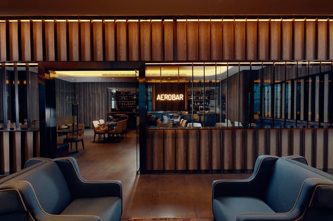 The Aerobar at Plaza Premium Lounge in Dubai International Airport features seating and a bar area for travelers.