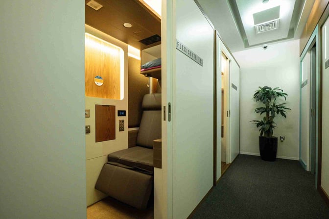 The Sleepover Lounge at Dubai International Airport Concourse C features private Flexisuites with reclining chairs and personal controls for passenger comfort.