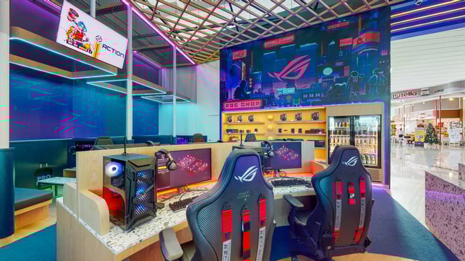 The Game Space at Dubai International Airport features gaming stations with high-performance PCs and ergonomic chairs for travelers.