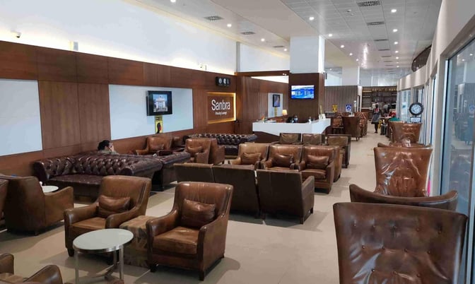 The Sanbra Priority Lounge at Kotoka International Airport features comfortable leather seating and a bar area for travelers.