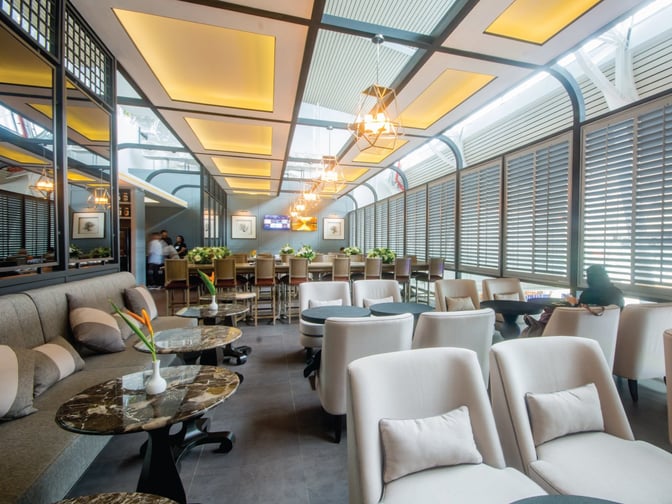 The Coral Executive Lounge at Phuket International Airport features comfortable seating and a bar area for travelers to relax.