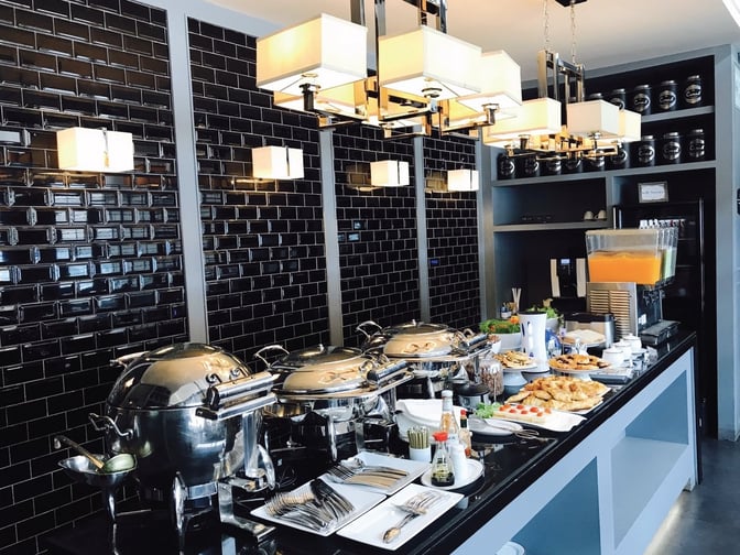 The Coral Executive Lounge at Phuket International Airport features a self-serve buffet with hot dishes, pastries, and beverages.