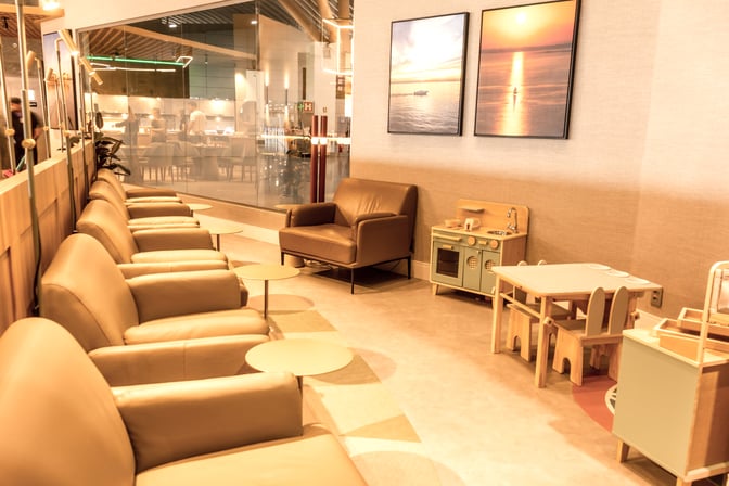 The W Premium Lounge at Salgado Filho International Airport features a seating area with comfortable chairs.
