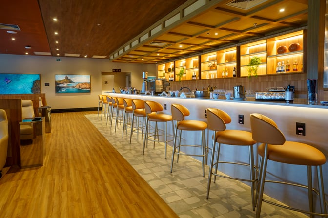 The W Lounge Recife features a bar area with counter seating, offering a selection of beverages and spirits for guests.