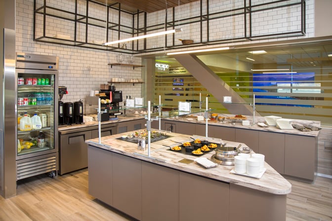 The Escape Lounge at Reno–Tahoe International Airport features a self-serve food area with a variety of snacks and beverages.