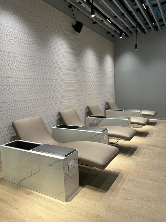 Reclining lounge chairs at Primeclass Lounge in Leonardo da Vinci-Fiumicino Airport offer built-in charging stations for travelers.