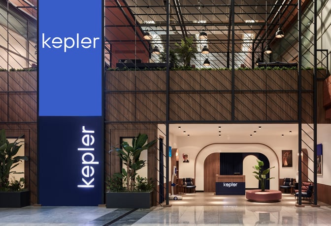 The entrance to the Kepler Club at Sabiha Gokcen International Airport features a reception desk and seating area.
