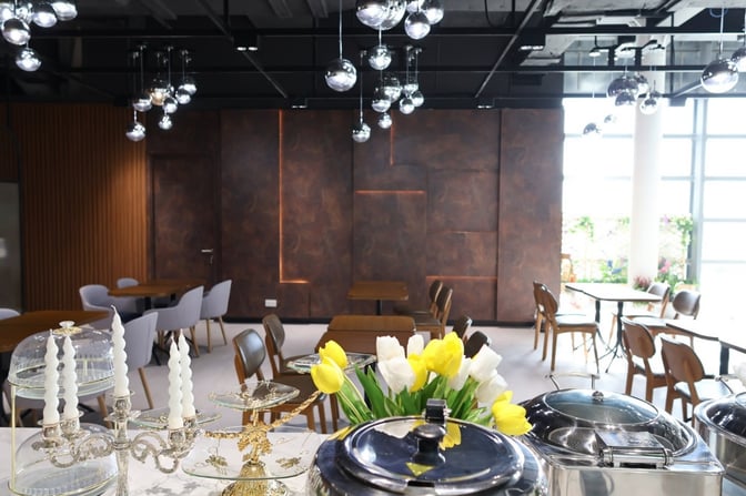 The Angkor Lounge at Siem Reap–Angkor International Airport features a dining area with tables, chairs, and a buffet setup.