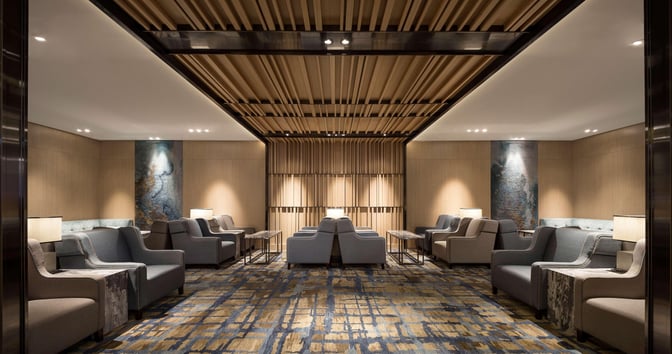 Seating area in Plaza Premium Lounge, Zone D at Taiwan Taoyuan International Airport, features armchairs and side tables for passenger comfort.