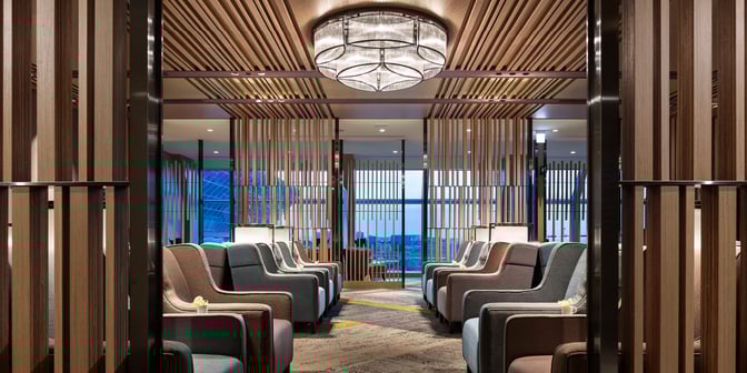 The seating area in Plaza Premium Lounge, Zone A at Taiwan Taoyuan International Airport, features rows of comfortable chairs with privacy dividers.
