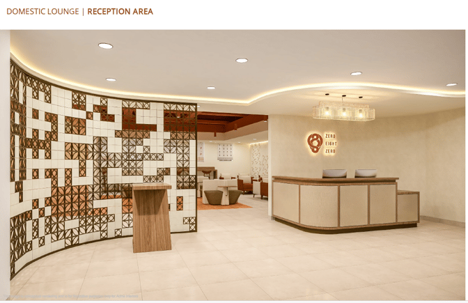 The reception area at O'Vetra Domestic Lounge, Tiruchirappalli International Airport, features a check-in desk and seating visible in the background.