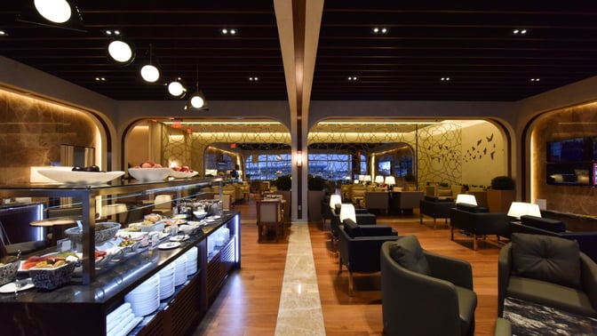 The Turkish Airlines Lounge at Washington Dulles features a self-serve food area with seating, offering a variety of dining options.