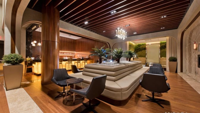 The Turkish Airlines Lounge at Washington Dulles features a seating area with cushioned chairs and a bar offering various beverages.