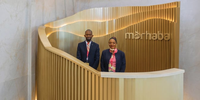 The Marhaba Lounge entrance at Abeid Amani Karume International Airport features a reception desk staffed by two attendants.