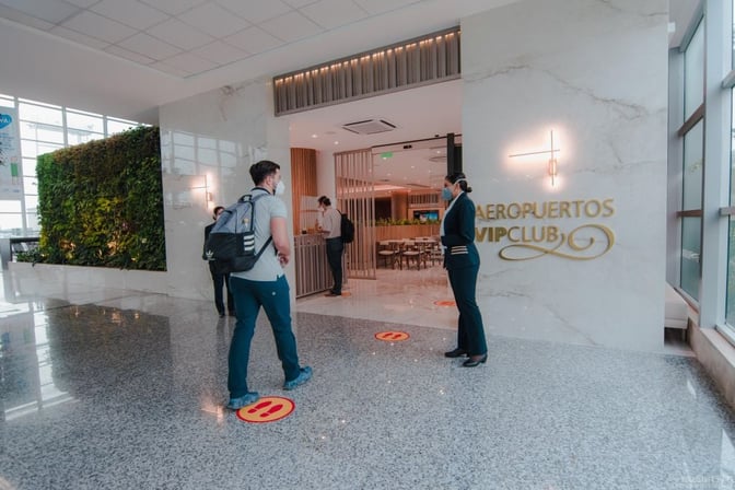 The entrance to the Aeroportos VIP Club at José Joaquín de Olmedo International Airport features a reception area and visible seating inside.