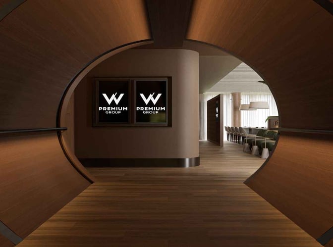 The entrance to the W Premium Lounge at Afonso Pena International Airport features a distinctive circular design leading to a seating area.