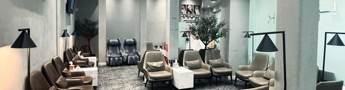 The Hayyak Lounge at King Saud Domestic Airport features comfortable seating with massage chairs and small tables for passenger convenience.