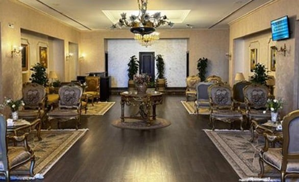 The Pearl Lounge at Aswan International Airport features ornate seating arrangements and a central table, providing a comfortable waiting area for travelers.