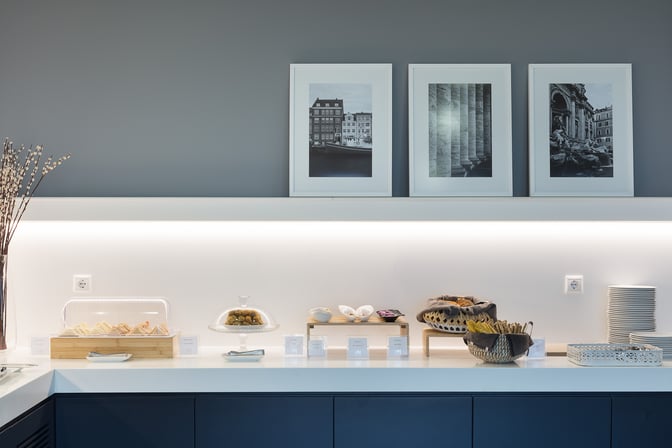 Self-serve snack station in the Goldair Handling CIP Lounge offers sandwiches, pastries, and other light refreshments at Athens International Airport.