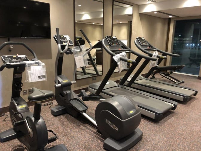 The Gulf Spa at Bahrain International Airport features a fitness area with treadmills and exercise bikes for travelers.