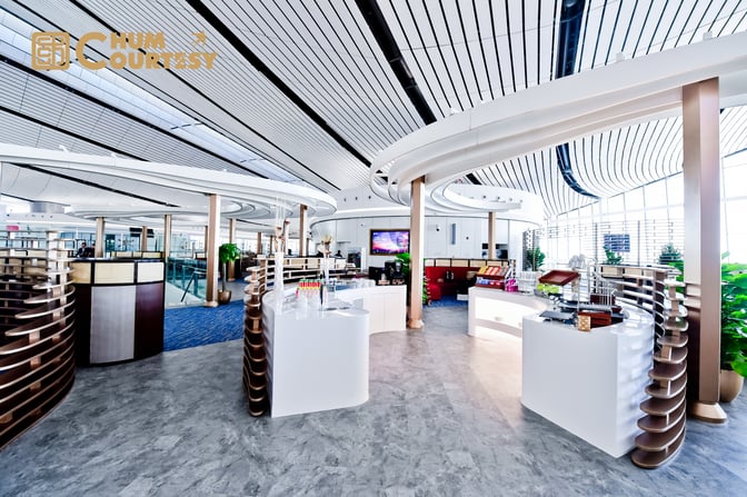 The CHUM VIP Lounge at Beijing Daxing International Airport features a self-serve snack and beverage area with various refreshments.