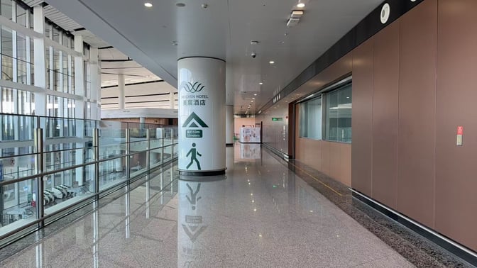 The corridor at Beijing Daxing International Airport leads to the Meichen VIP Lounge, with signage indicating a 53-meter distance.