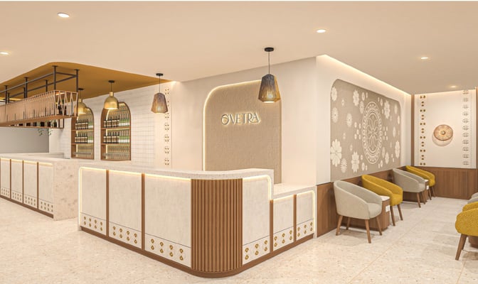 The O'Vetra Domestic Lounge at Biju Patnaik International Airport features a reception area with seating and decorative wall designs.