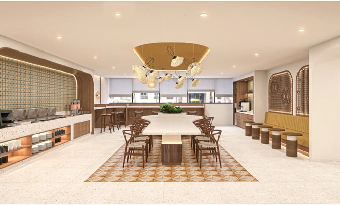 The O'Vetra Domestic Lounge at Biju Patnaik International Airport features a central communal table, self-serve food stations, and bar seating.