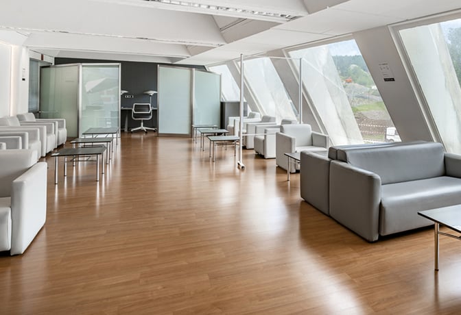 The Nervión VIP Lounge at Bilbao Airport features spacious seating with armchairs and sofas, offering views of the airport runway.