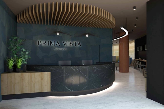 The Prima Vista Lounge reception at Bologna Airport features a curved desk and seating area, welcoming guests upon entry.