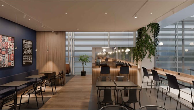 The seating area in the Pearl Lounge at Bratislava International Airport features tables and chairs with views of the tarmac.