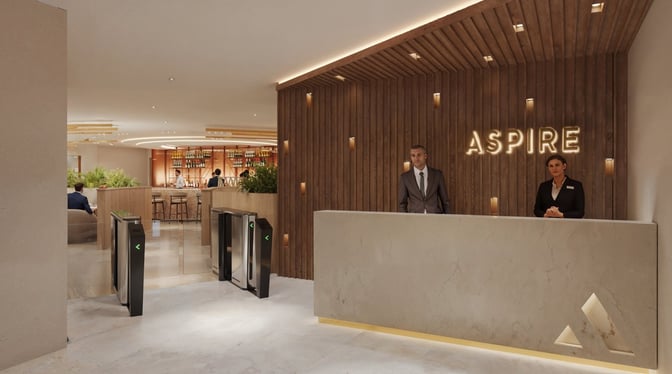 The entrance to the Casablanca Aspire Lounge features a reception desk with staff and security gates leading to the bar area.