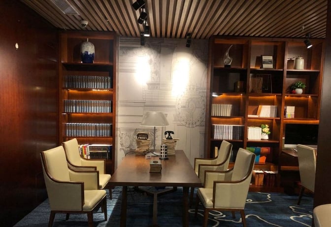 The Book Bar at Changsha Huanghua International Airport features a reading area with bookshelves, a central table, and seating for passengers.