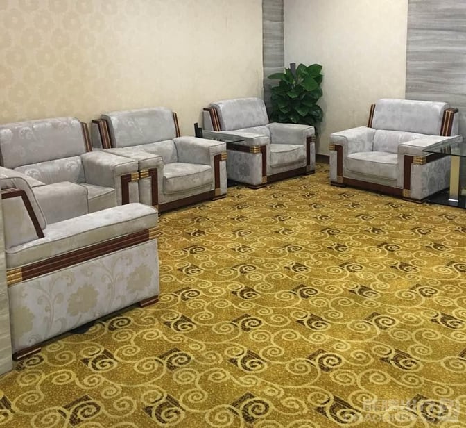 The seating area in the Joyflight Network Reservation Lounge at Changsha Huanghua International Airport features comfortable armchairs and a decorative plant.