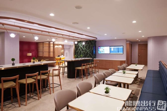 The Plaza Premium Lounge at Clark International Airport features a seating area with tables, chairs, and a bar counter for guests.