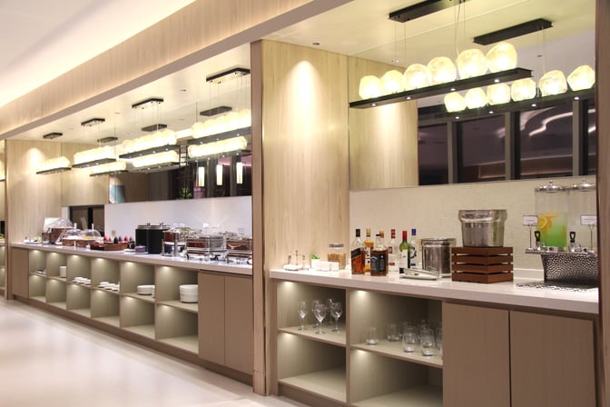 The Marhaba Lounge at Clark International Airport features a self-serve buffet with a selection of beverages and dining ware.