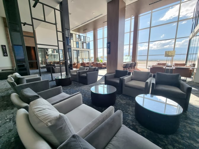 The VIP Lounge at Comayagua International Airport features spacious seating with large windows offering expansive views of the runway.