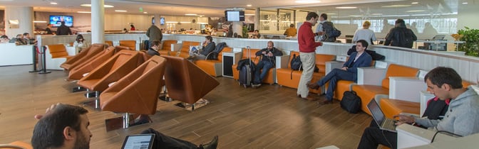 The Salones VIP Pacific Club lounge at Comodoro Arturo Merino Benítez International Airport features comfortable seating and a self-serve dining area.