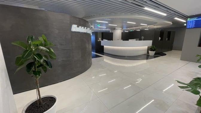 The Goldair Handling Lounge entrance at Ioannis Kapodistrias International Airport features a reception desk and flight information display.