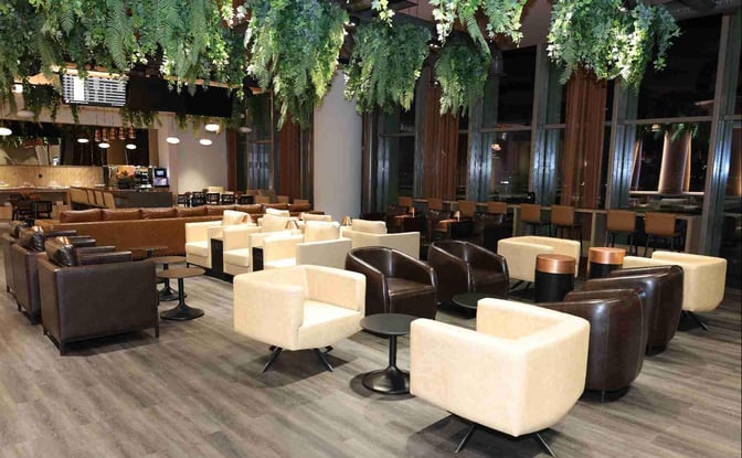 The Celebi COV Domestic Lounge at Cukurova International Airport features a spacious seating area with armchairs and small tables.