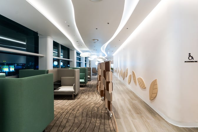 Semi-private seating areas at Vanda Lounge in Da Nang International Airport offer comfortable spaces for relaxation with airport views.