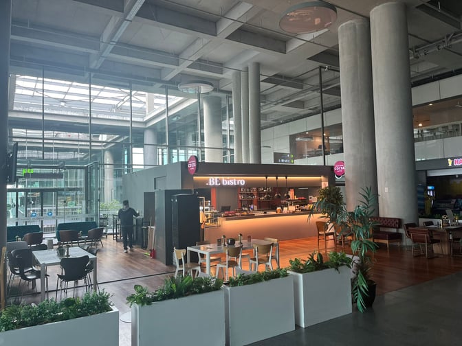 The .be bistro at Dalaman Airport features a bar area with seating, offering beverages and light dining options for travelers.