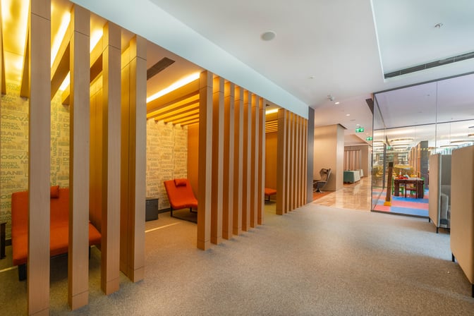 The CIP Lounge at Dalaman Airport features semi-private seating areas with comfortable chairs and a view into the main lounge area.