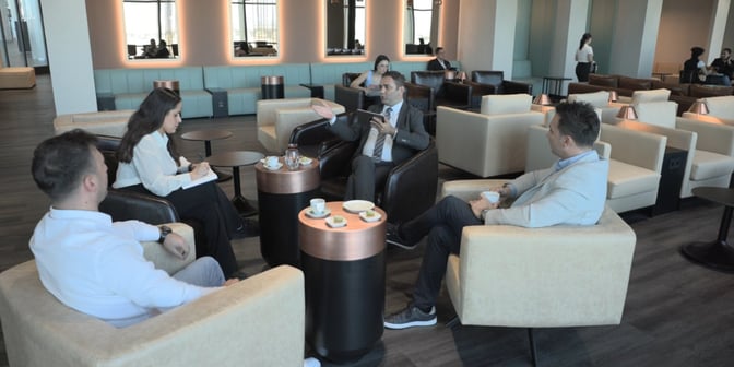 The Celebi DIY CIP Lounge at Diyarbakir Airport features comfortable seating areas with tables for drinks and snacks, facilitating conversation.