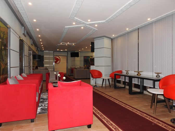 The Beira Lounge at Djibouti–Ambouli International Airport features seating areas with armchairs and tables, providing a comfortable waiting space for travelers.