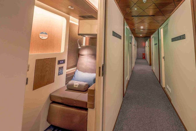 The Sleepover South Node at Doha Hamad International Airport features private sleeping pods with reclining seats and personal control panels.