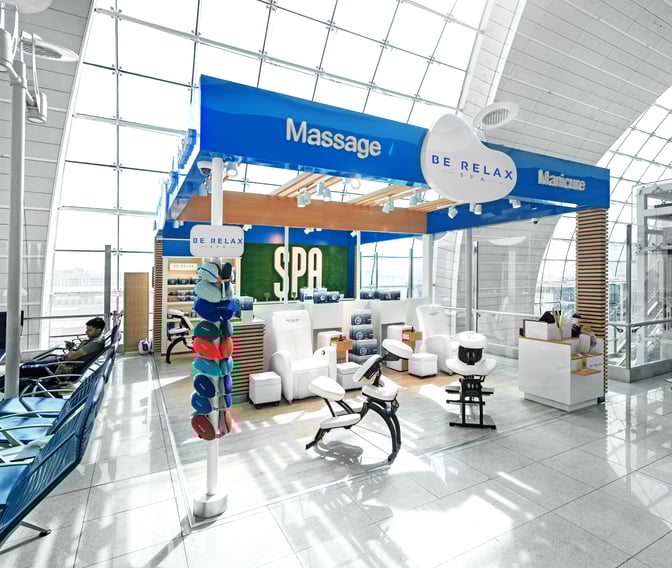 The Be Relax Spa B18 at Dubai International Airport offers massage and manicure services with dedicated seating and treatment areas.