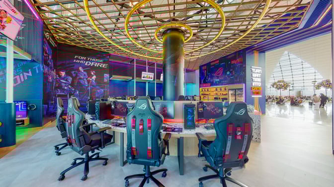 The Game Space at Dubai International Airport features gaming stations with ergonomic chairs and high-performance computers for travelers.